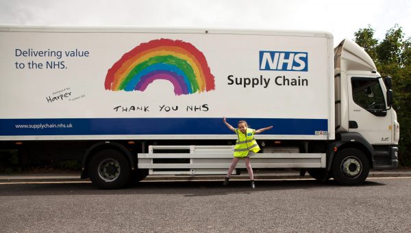 A child and an NHS Supply Chain lorry