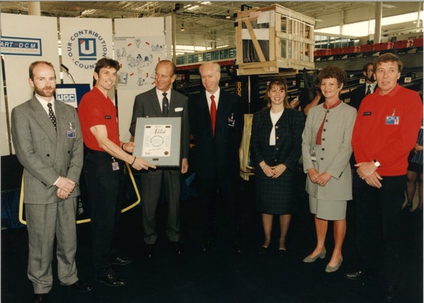 HRH Duke of Edinburgh presents an award to John Neill and Unipart employees in June 1995