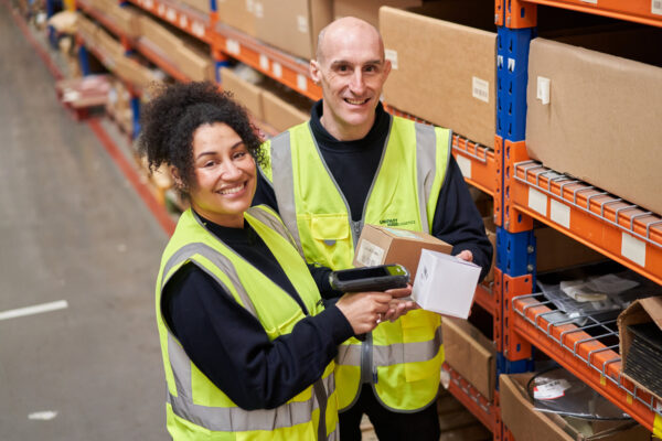 Two Unipart employees in a warehouse SAP