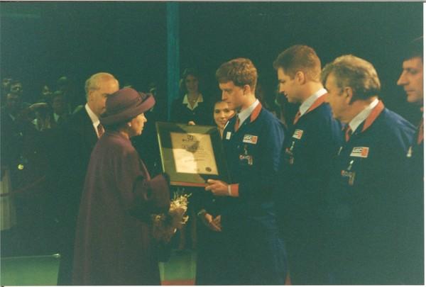 HRH Queen Elizabeth II presenting an Our Contribution Counts award