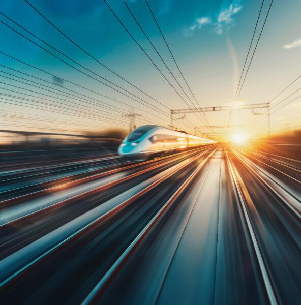 High speed train moving along railway tracks.