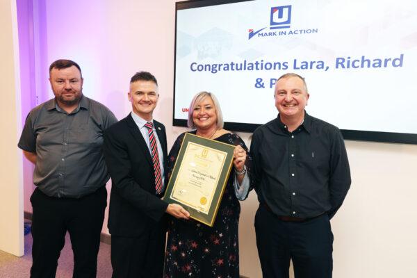 Mark in Action ceremony - Unipart CEO, Darren Leigh, awarding a certificate to colleagues.