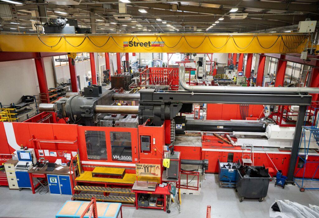 A large industrial injection moulding machine.