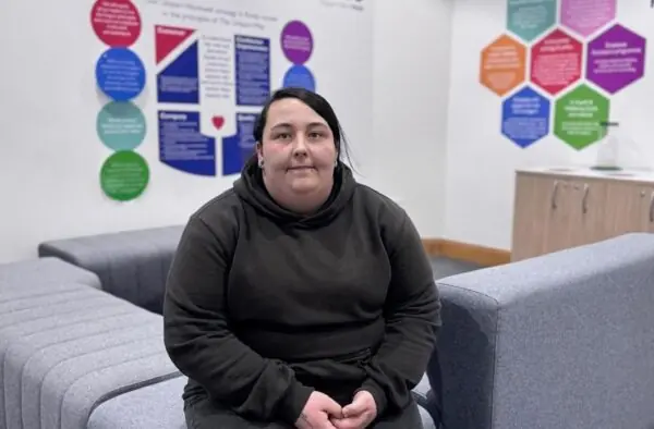 Tamara Kevis sat on a sofa in a Unipart office.