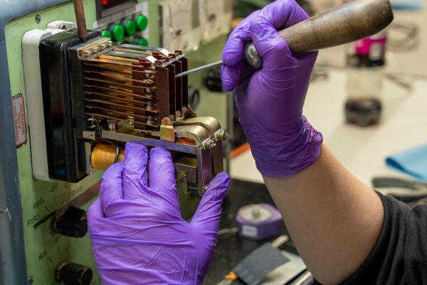 MRO engineer handling industrial relay switch