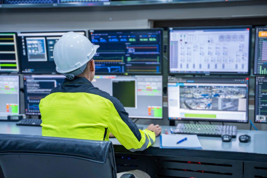 Person at control screens