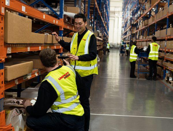 Warehouse operatives in high vis vests